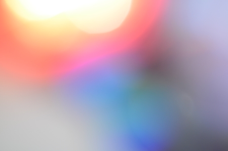 Natural abstract colorful bokeh background received from the light of lamp on CD disk with glitter, defocusedの写真素材