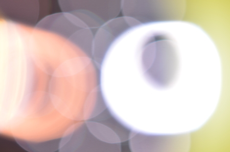 Natural abstract colorful bokeh background received from the light of lamp on CD disk with glitter, defocusedの写真素材