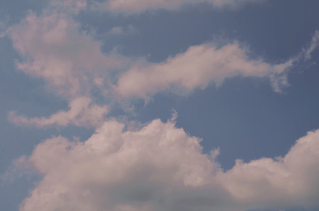 Nature background. Fluffy soft clouds in sky tonedの写真素材