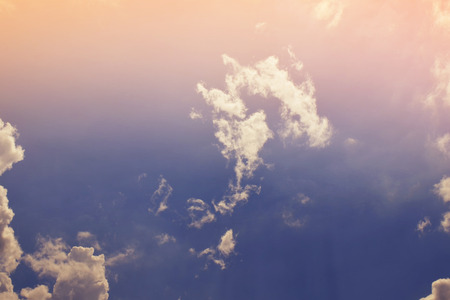 Nature background. Fluffy soft clouds in sky tonedの写真素材