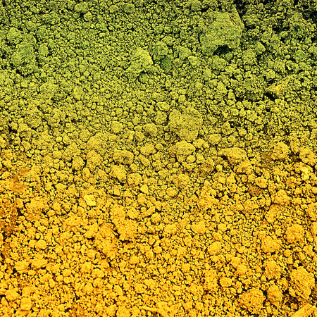 Abstract colorful texture background in grunge style closeup made from natural ground
