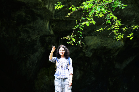 Traveling woman looking into the distance, outdoors. Girl thinking how to hikeの写真素材