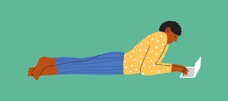 Male character lying down working on laptop. Man in pajamas relaxing on floor browsing internet, chatting social media, writing, shopping online. Work at home, freelancing. Lifestyle vector illustrationのイラスト素材