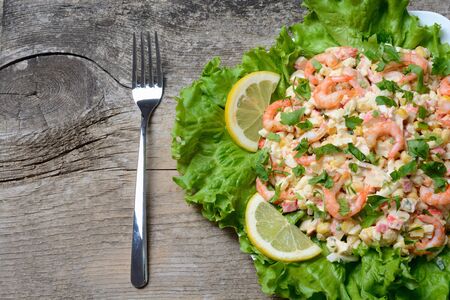 Seafood salad with shrimps on wooden backgraundの写真素材