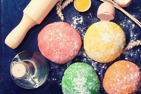 Preparation of homemade pasta on wooden background