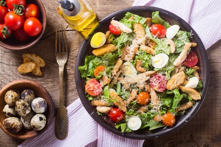 Healthy Chicken Caesar Salad with tomato and Croutonsの写真素材