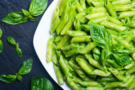 pasta with spinach pesto sauce, green basilの写真素材