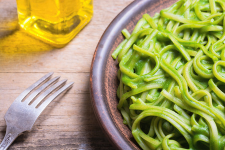 pasta with spinach pesto sauce, green basilの写真素材