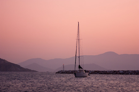 Yacht in the sea after sunsetの写真素材
