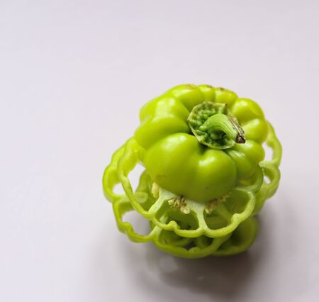 sliced green pepper on a light background close upの写真素材