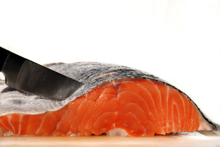 Salmon steak with knifeの写真素材