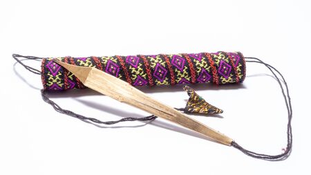 Dan Moi Jaw harp and decorated case for it. Isolated on white background.