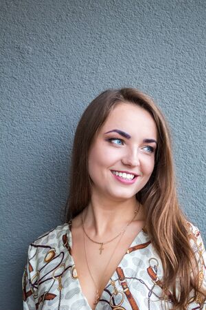 Beautiful, young, romantic blue-eyed girl. The face turned slightly to the side, a thoughtful look....