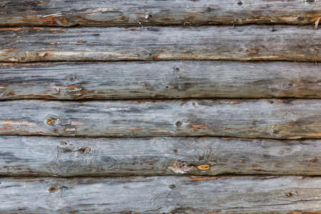 Log cabin or shed unpainted debarked wall textured. Horizontal background.の写真素材