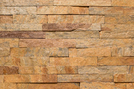 Seamless texture, construction and design. Brown brick masonry stone. Stone wall background. Facing stone.の写真素材