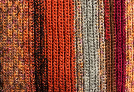 GreeGreen and orange background with checkered pattern, closeup. Structure of the fabric macro.n and orange background with checkered pattern, closeup. Structure of the fabric macro.の写真素材