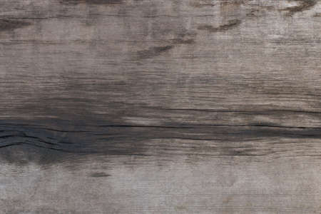 Dark old weathered, wooden texture as background. Rotten wood.の写真素材