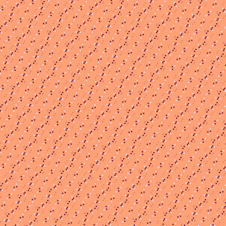 Small white and brown polka dot diagonal border isolated on a light bleached orange, peach, apricot...