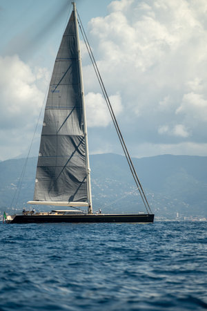 gentle boat glides over vast waters, serene yacht moves smoothly through expansive blue seas
