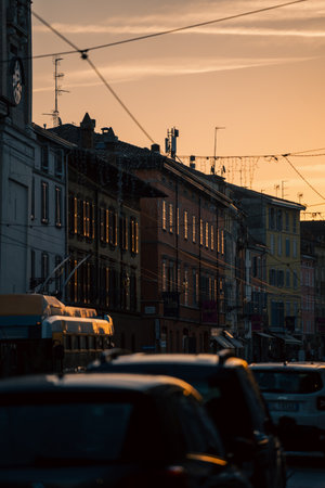 crowded city road at dusk, city during evening rush hour with moving vehicles and pedestriansの写真素材