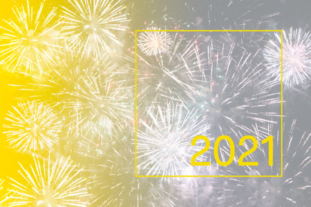 abstract background toned in yellow and gray colors. Blurred image of festive fireworksの写真素材