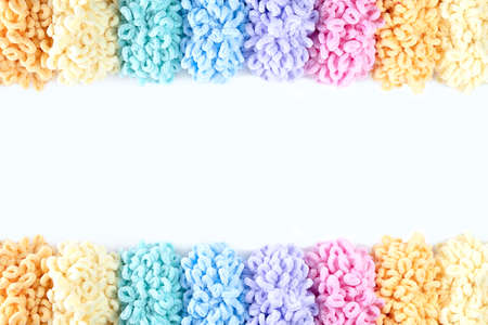 skeins of multicolored terry yarn lined up like a rainbowの写真素材