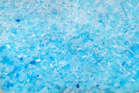 Scented blue bath salt or body scrub. Natural skin care product. Hygienic routine.の写真素材