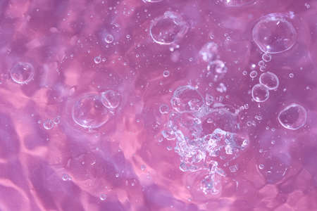 Abstract background. The texture of the waves on a blue background. Bubbling water, splashes and...