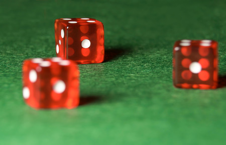 Casino dices on green cloth. The concept of online gambling.