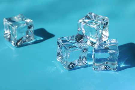 ice cubes for drinks on blue backgroundの写真素材