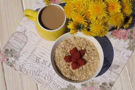 breakfast with porridge with raspberry and coffee