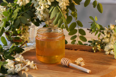 jar of honey with flowersの写真素材