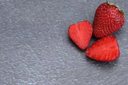gray background with strawberries and copy space