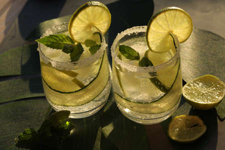 glasses with fresh cold lemonade with mint and limeの写真素材