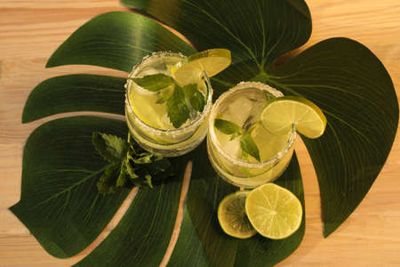 glasses with fresh cold lemonade with mint and limeの写真素材