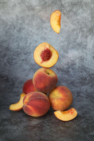 peaches on the gray background with copy space