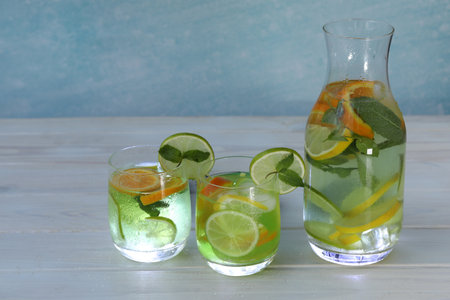 cold lemonade with lime, lemon and orange slicesの写真素材
