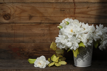 bouquet of white roses on the wooden background with copy spaceの写真素材