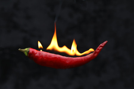 red hot chili pepper with a fire flame