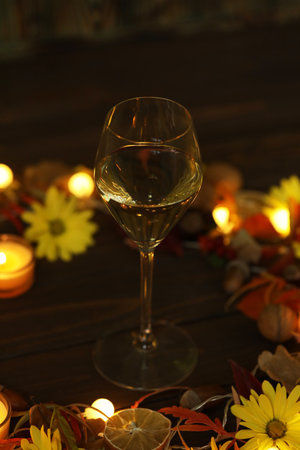 glass of white wine with autumn decorationの写真素材
