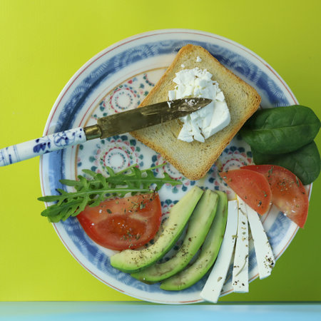 Diet toasts with cheese, salad, avocado and tomato. Healthy organic foodの写真素材