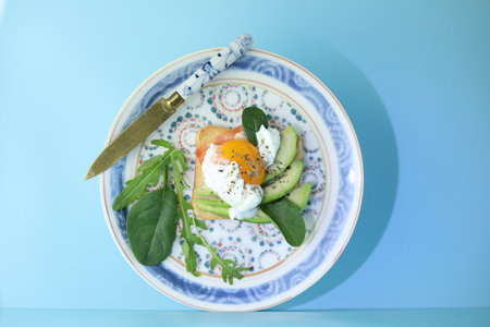 Diet toasts with cheese, salad, avocado, tomato and eggs. Healthy organic foodの写真素材