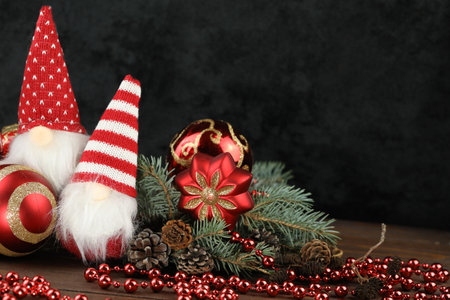 Black background with christmas decorations, dolls and copy spaceの写真素材
