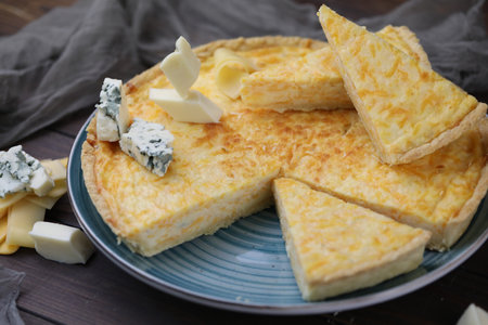 Delicious Quiche pie with four cheese fillingの写真素材