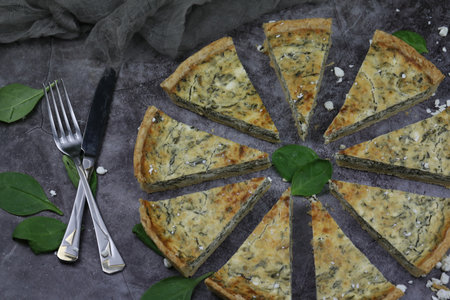 Delicious Quiche pie with cottage cheese and spinach fillingの写真素材