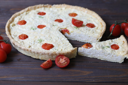 Delicious Quiche pie with chicken and tomatoes fillingの写真素材