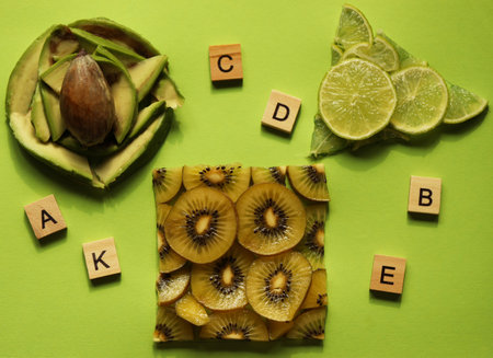 Sliced healthy food on green background. Vitaminsの写真素材