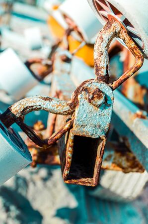 Close up of rusty metal parts and wheels of mechanism detail. Rusty nuts and bolts texture.の写真素材