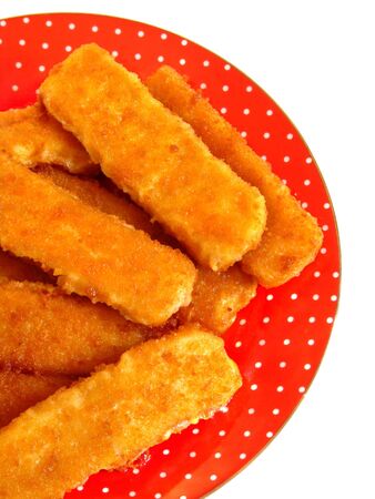 Fish fingers on the red plate. Isolationの写真素材