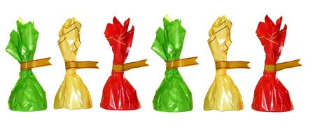 Chocolates in colorful wrappers, isolated on white の写真素材